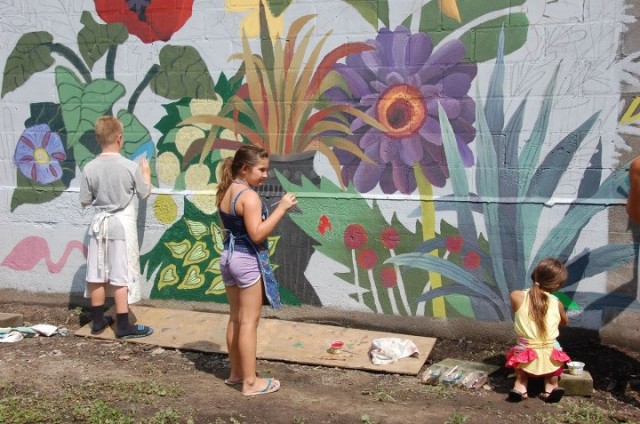 Painting the mural - photo by Janet Denney